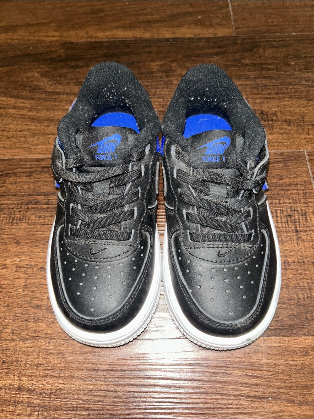 Nike Kids Black Sneakers with Blue Accents